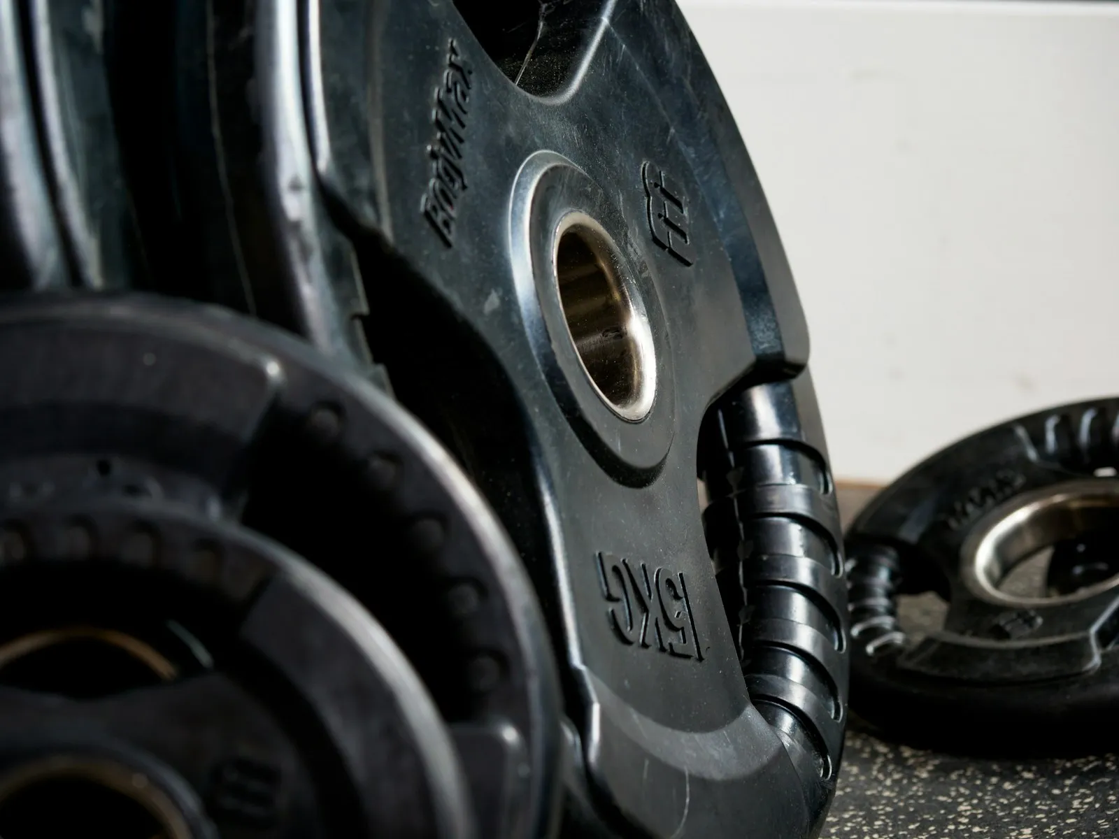 Weight plates stacked on a bar, close up